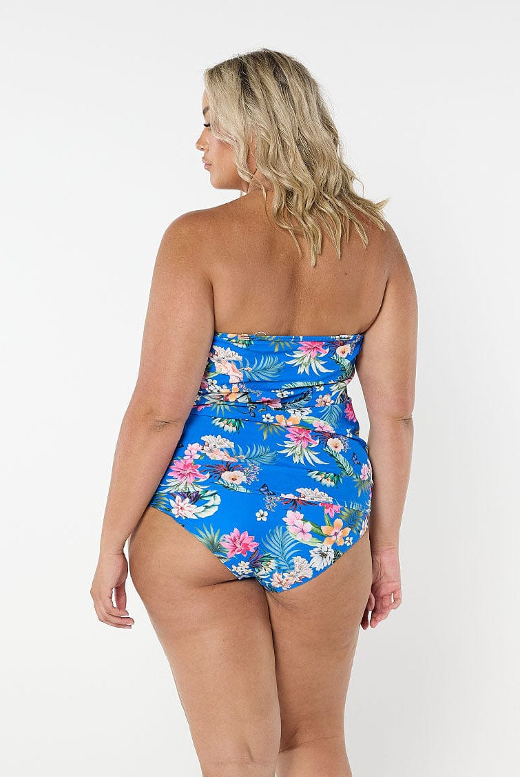 Blonde model wears floral blue bandeau tankini top with removable straps