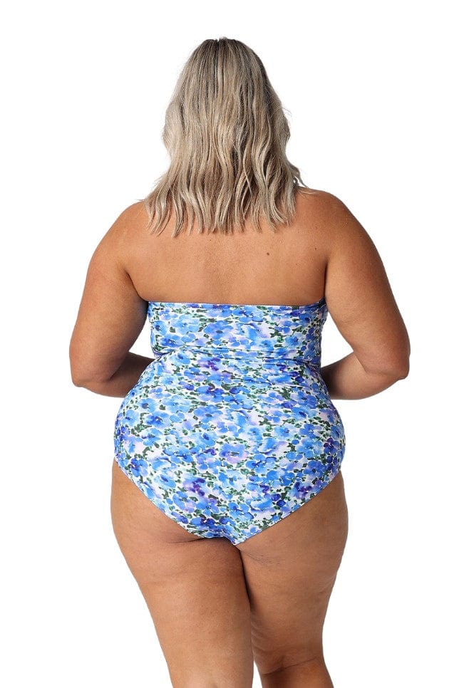 Model showing back of blue floral strapless swimsuit