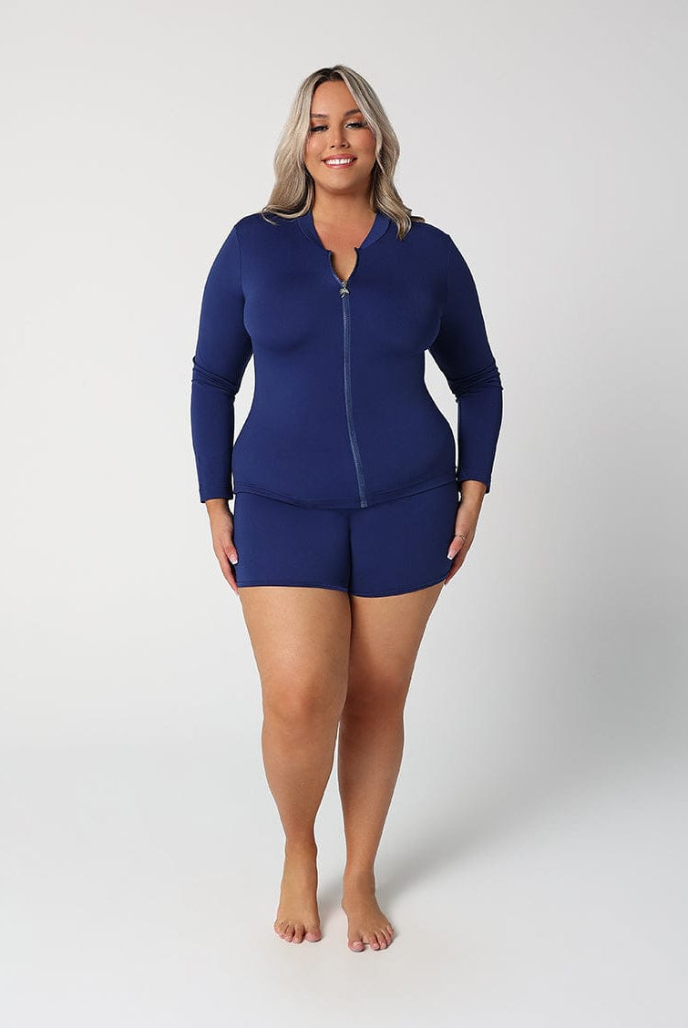 Woman wearing a blue swimsuit set on a white background