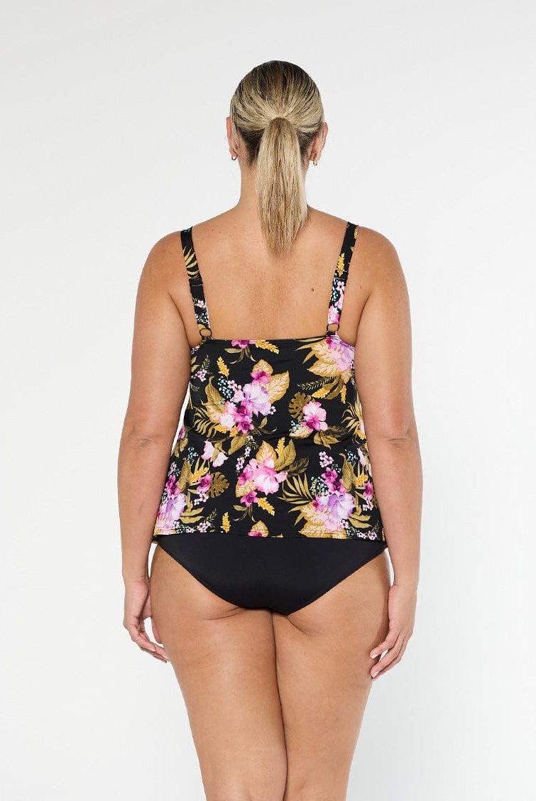 Blonde model shows the back of chlorine resistant pink and black floral tankini top with adjustable straps