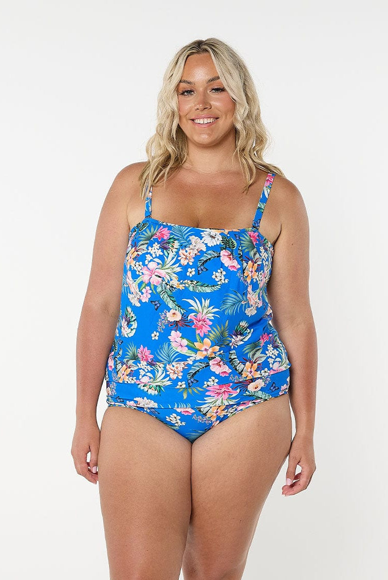 Blonde model wears full coverage high waisted swim bottom in blue floral print