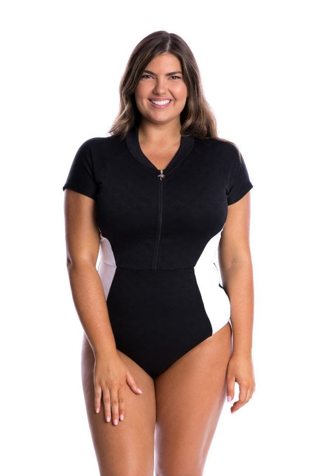 Woman wearing a black zip-up swimsuit on a white background
