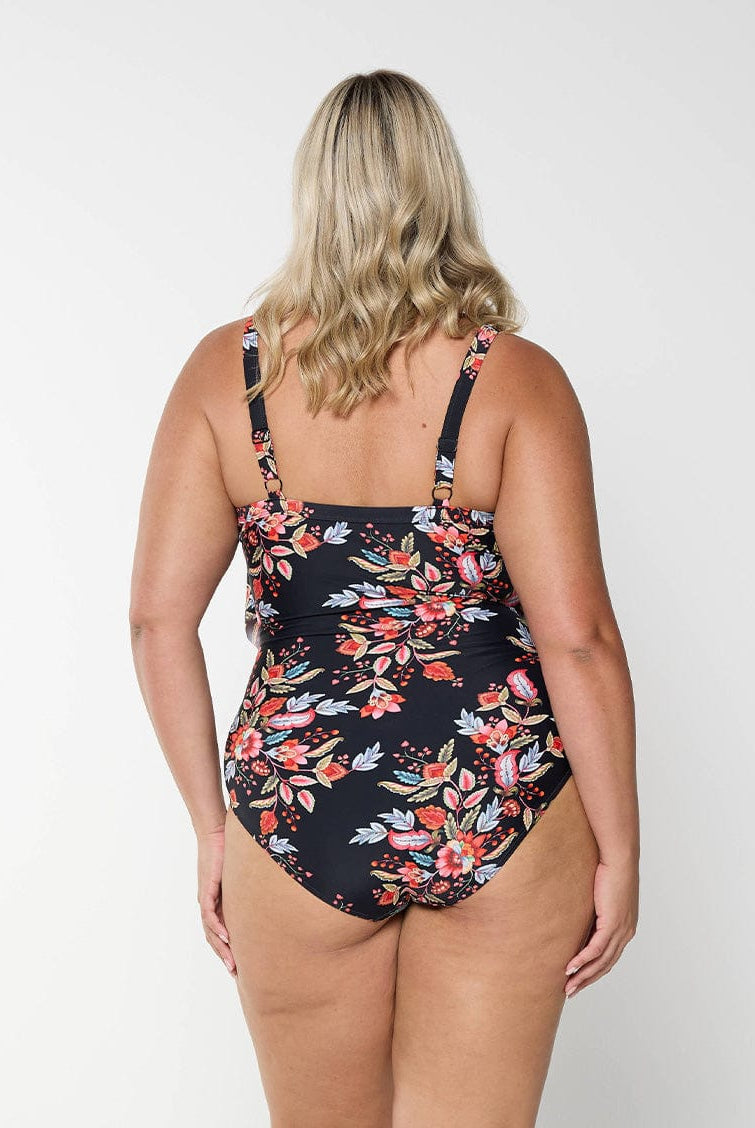 model showing back of black and red floral layered one piece