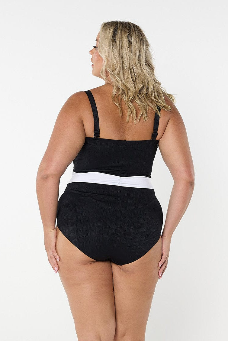 model showing back of black and white textured swimsuit