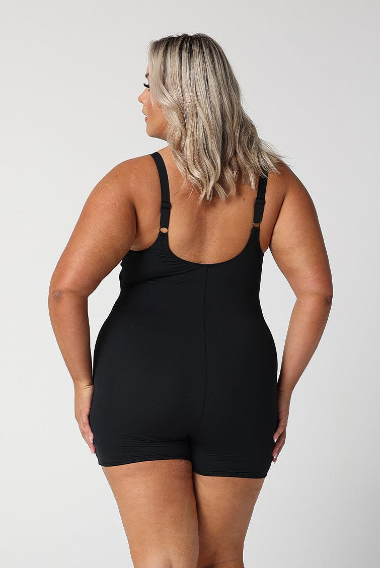 model showing back of black boyleg one piece