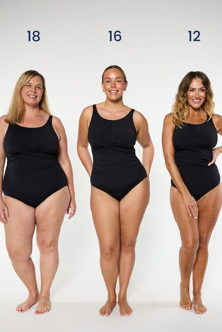 three models wearing black high neck one piece