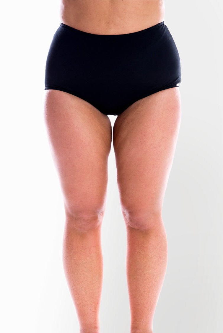 model wearing black high waisted swim bottom