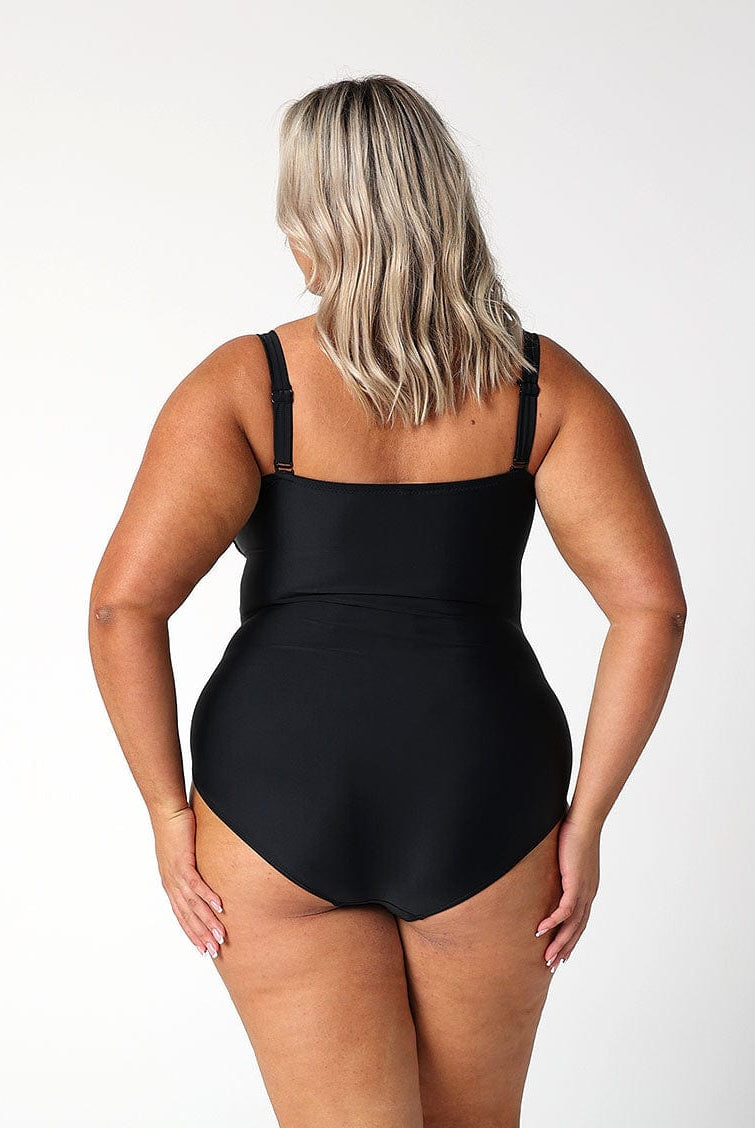 model showing back of black one piece