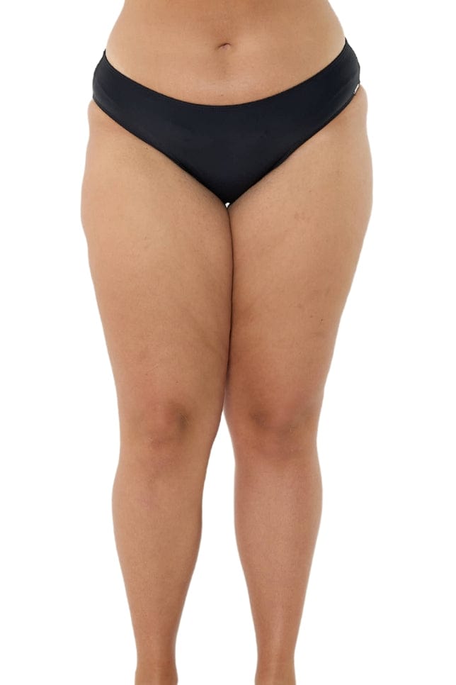 model wearing black low cut bikini bottoms