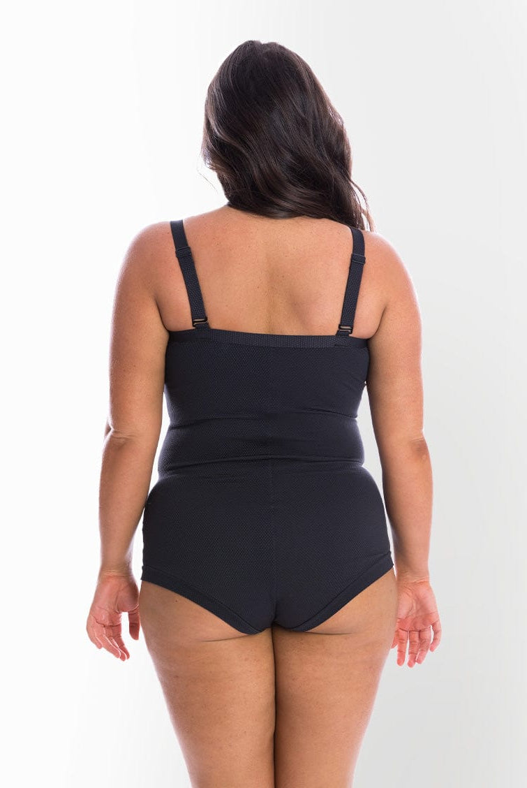 model showing back of black textured women's swimsuit