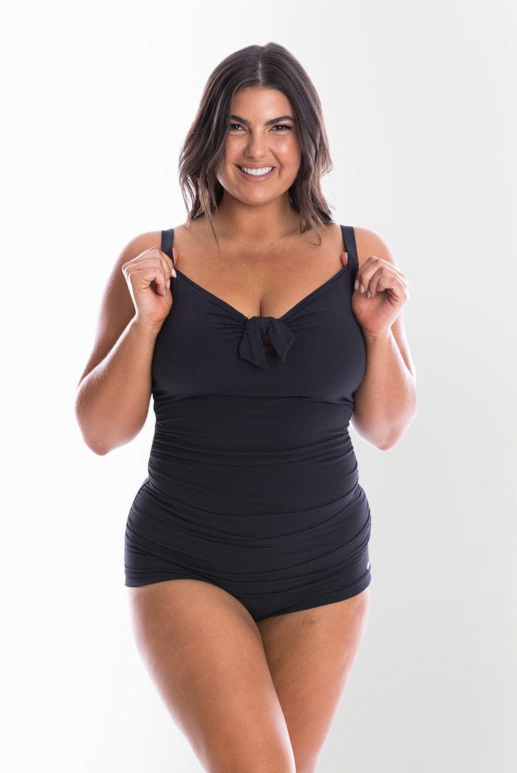 model wearing black textured fabric women's swimsuit