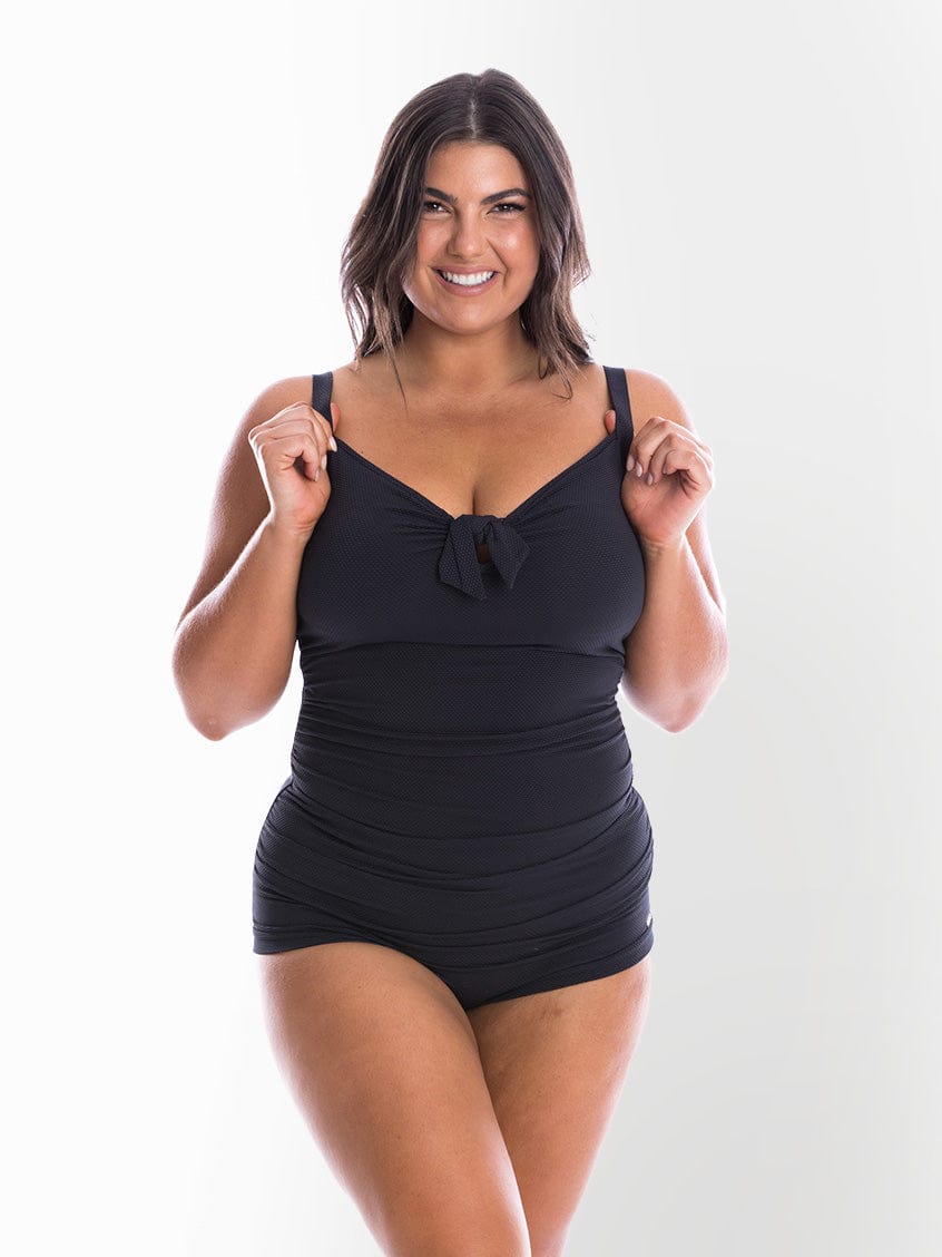model wearing black textured fabric women's swimsuit