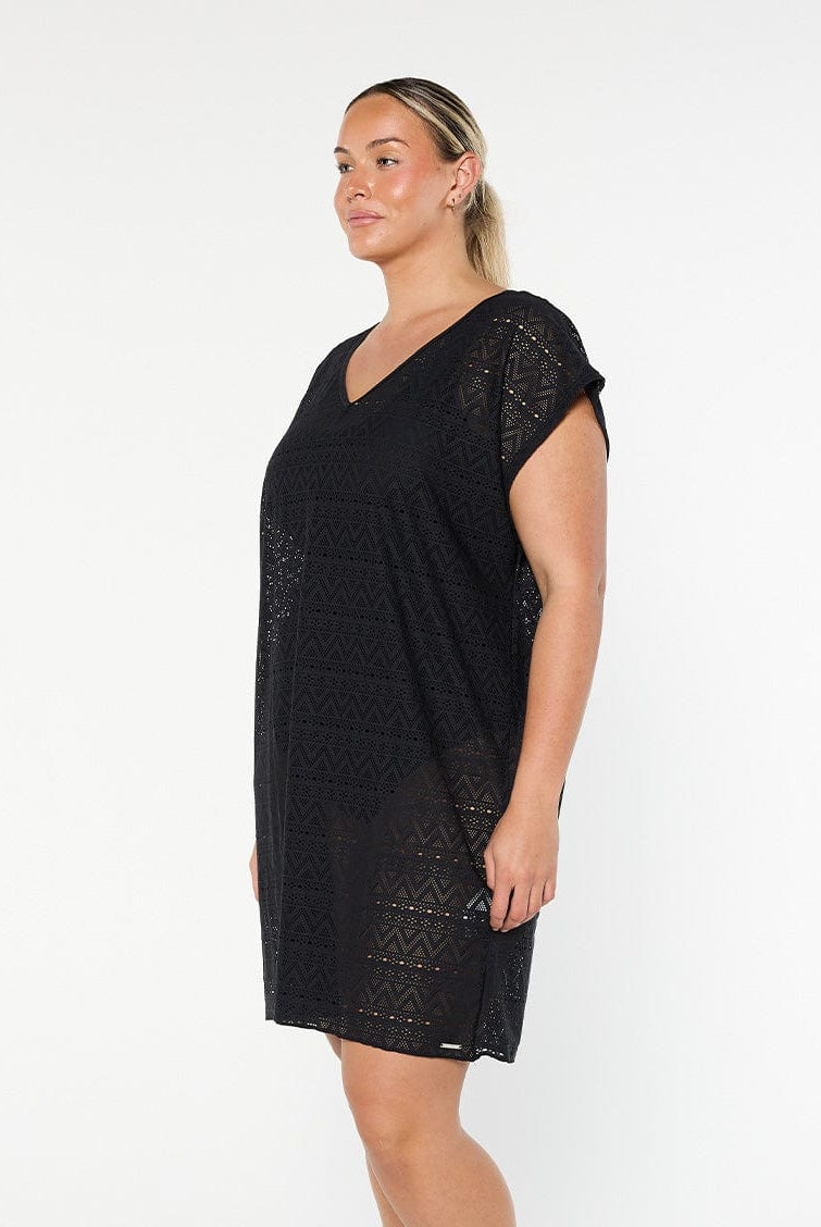model showing side of black mesh beach dress