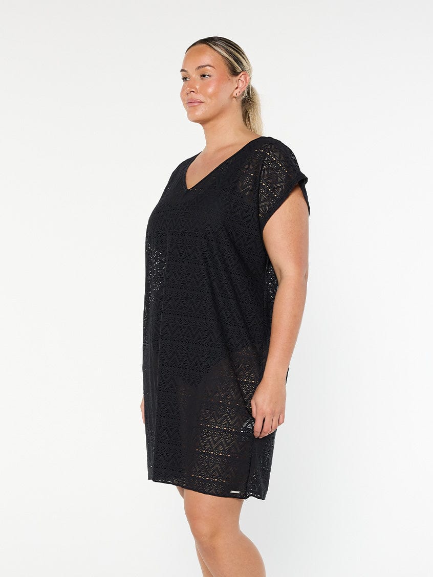 model showing side of black mesh beach dress
