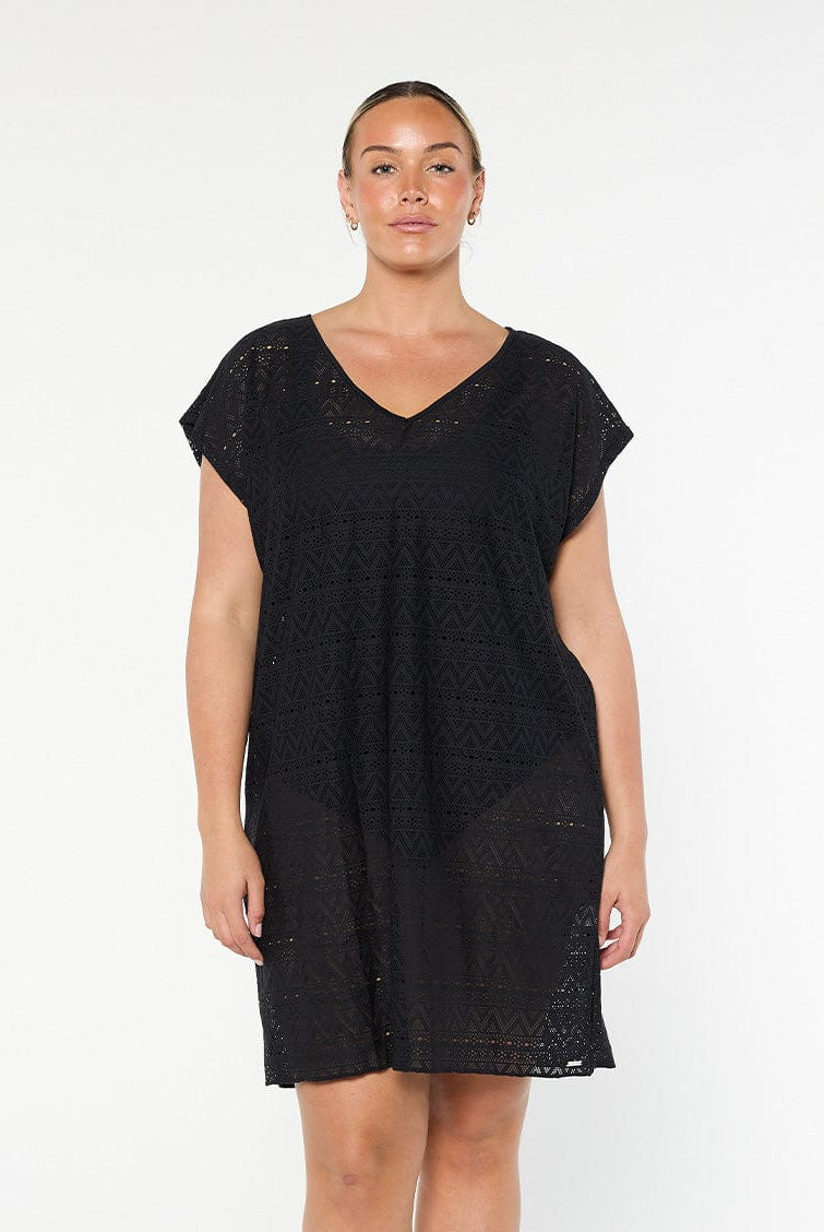 model wearing black mesh beach cover up