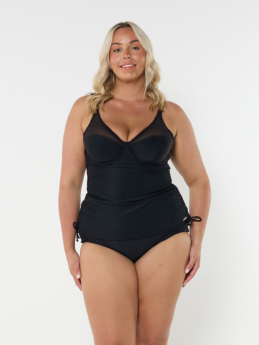 model wearing black mesh tankini with underwire