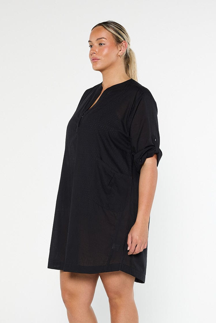 model wearing black over shirt cover up