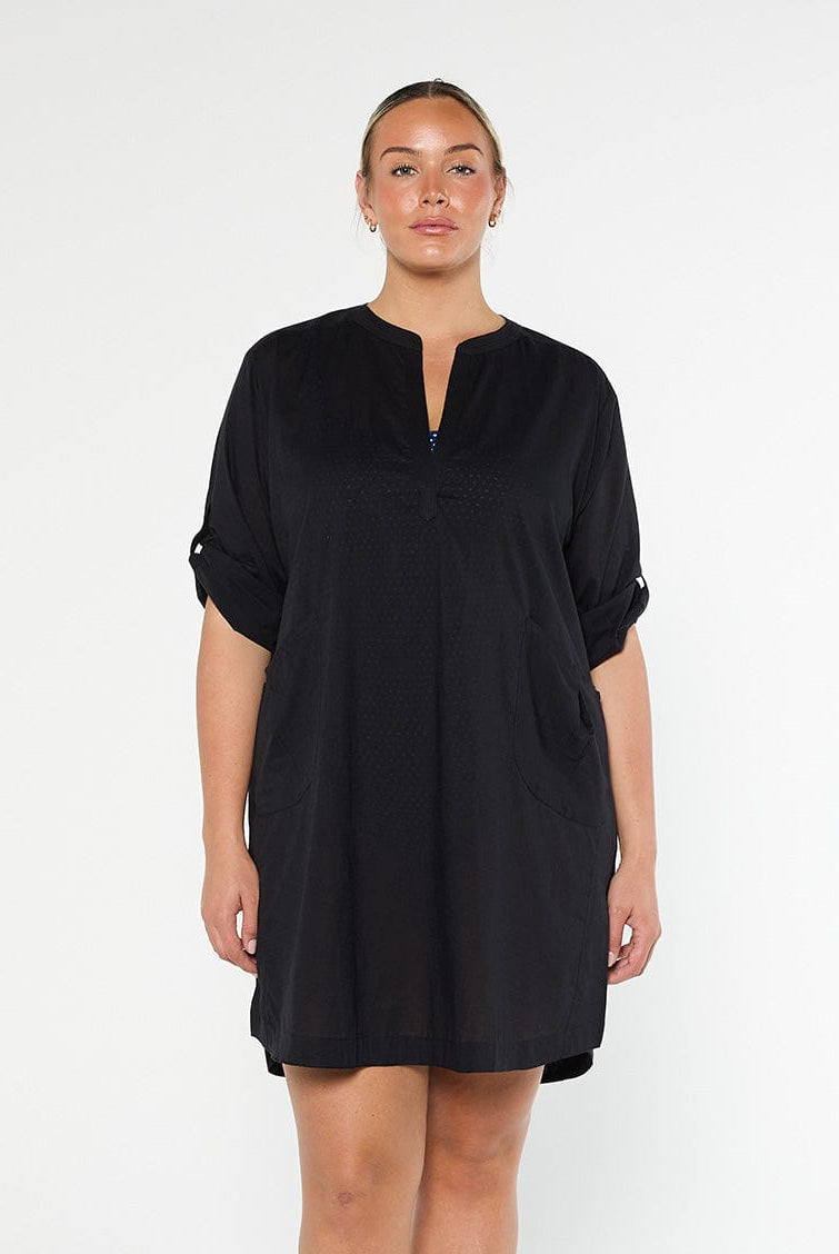model wearing black over shirt dress