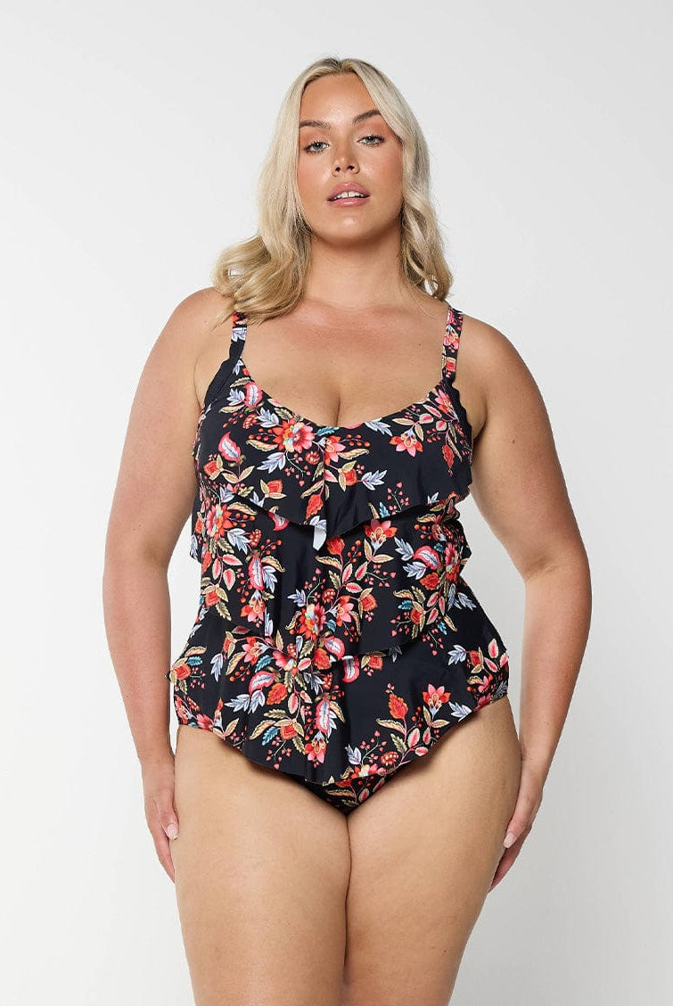 model wearing black and red floral women's one piece swimsuit