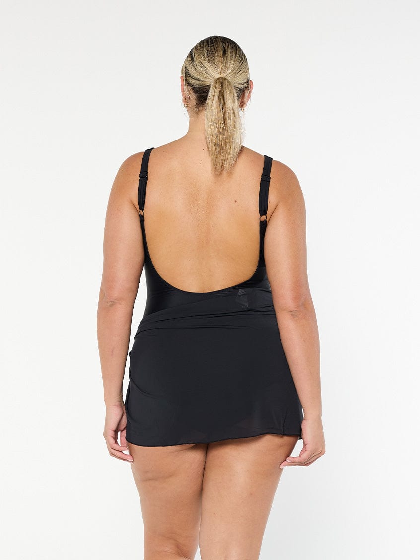 model showing back of black mesh skirt