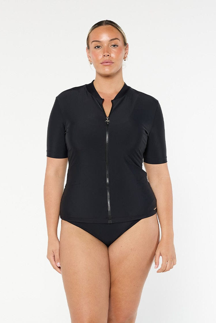 model wearing black short sleeve rash vest