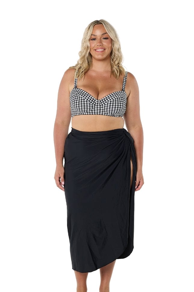 model wearing long black swim skirt