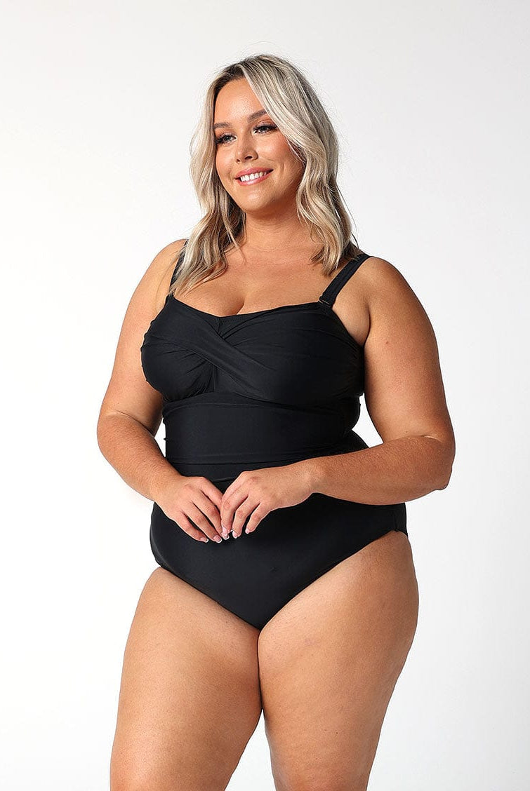 model showing side of black twist bandeau one piece