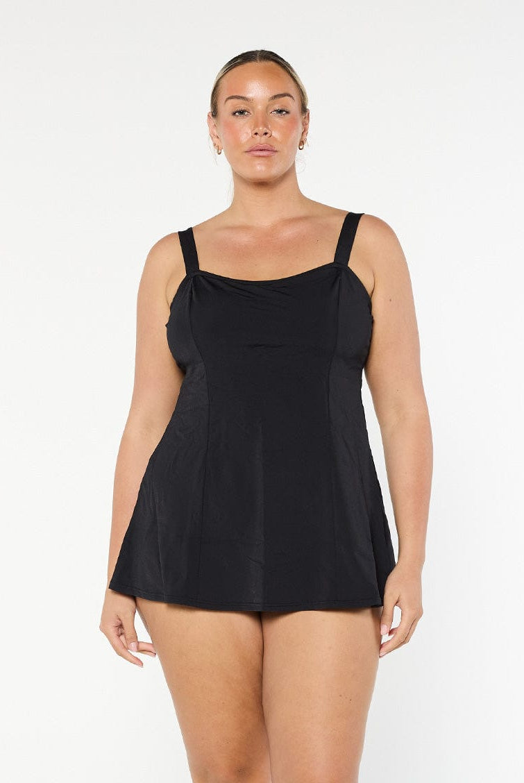 model wearing black chlorine resistant swim dress