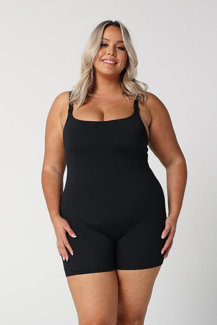 model wearing black boyleg one piece