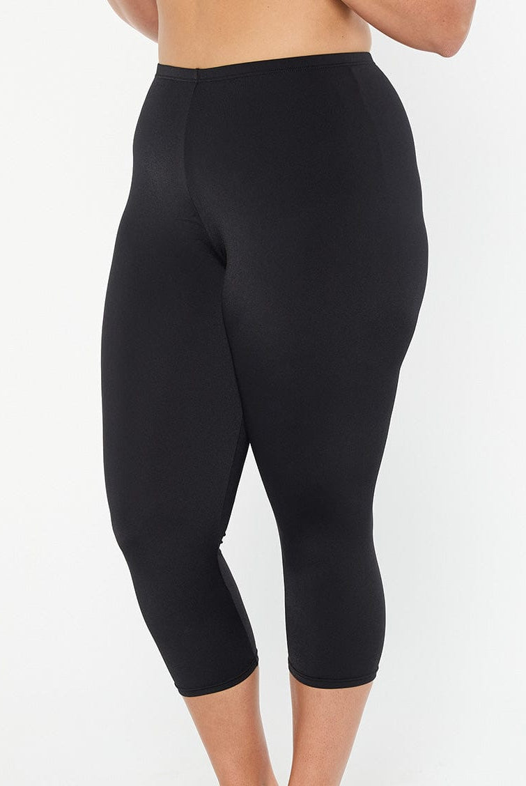 model showing side of black swim pant