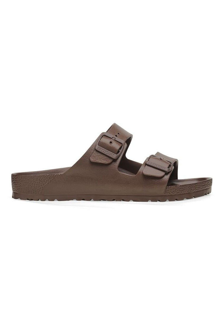 Brown sandal with double strap on a white background