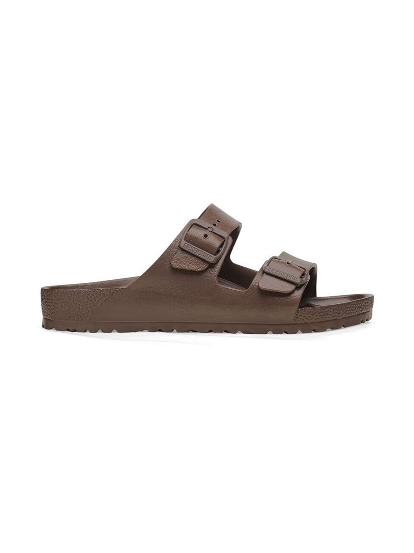 Brown sandal with double strap on a white background