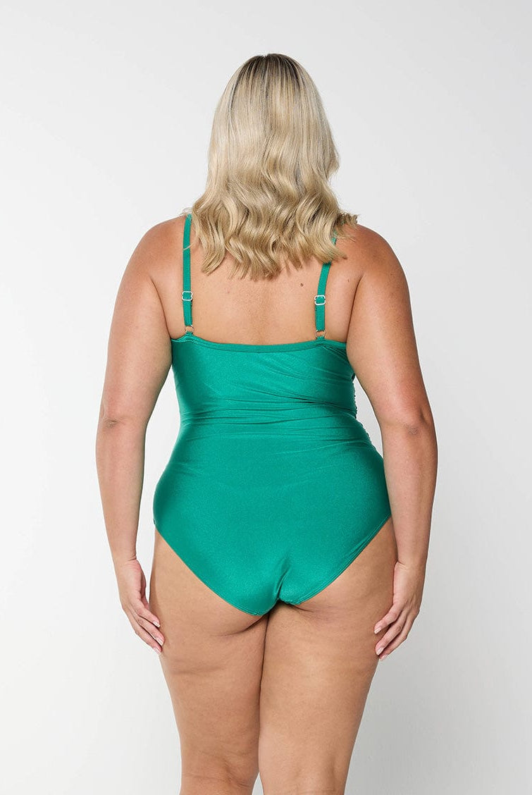 model showing back of metallic emerald women's swimsuit