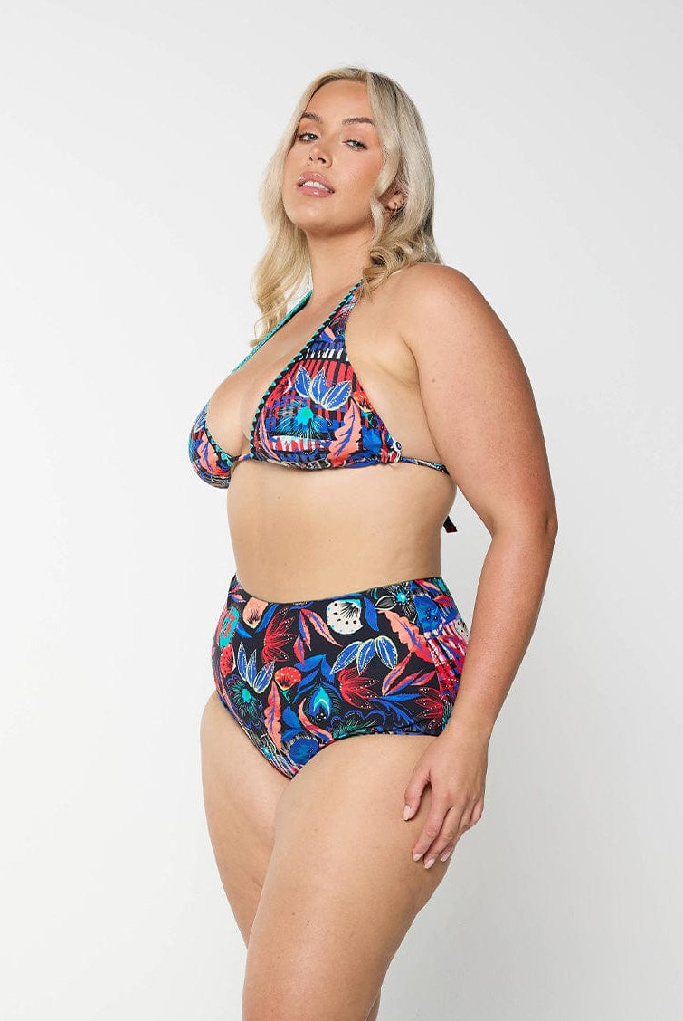 model wearing bright patterned swim pant