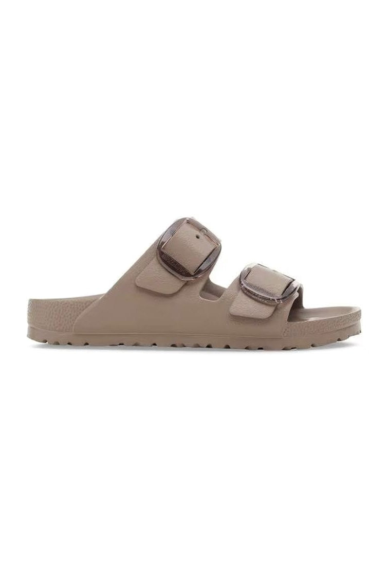 Beige sandal with two straps on a white background