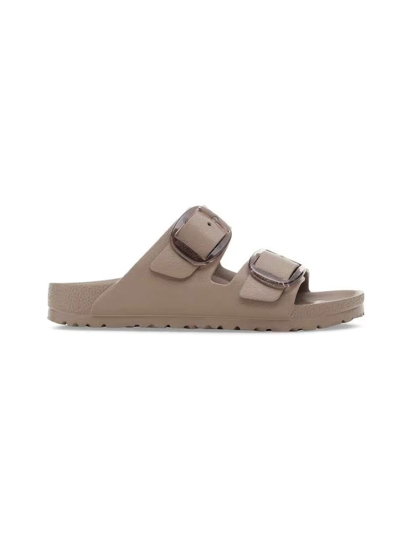 Beige sandal with two straps on a white background