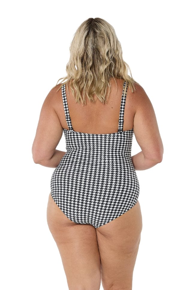 model showing back of black and white women's swimsuit