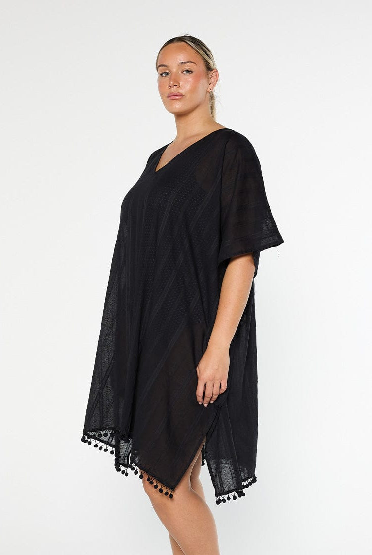 model showing side of black cotton kaftan