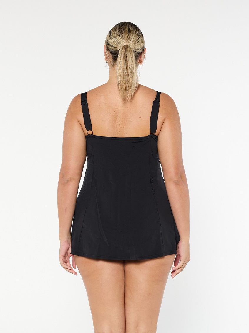 model wearing black chlorine resistant swim dress