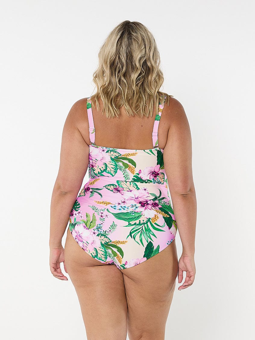 model showing back of pink floral women's swimsuit