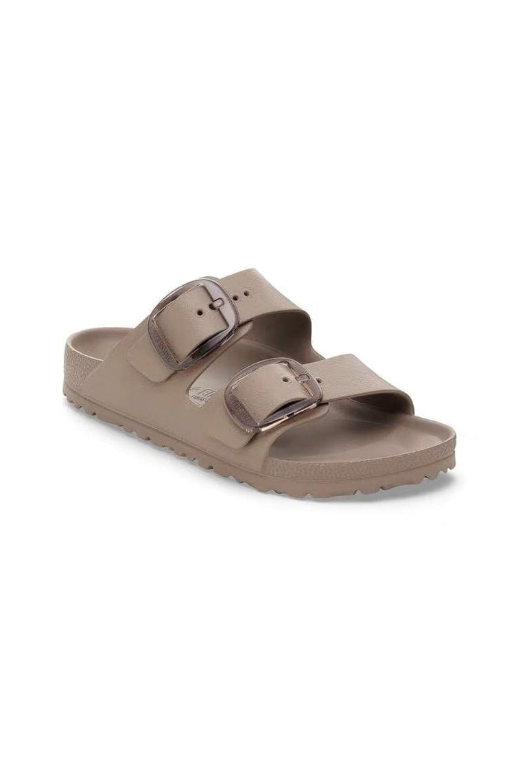 Brown sandal with two straps on a white background
