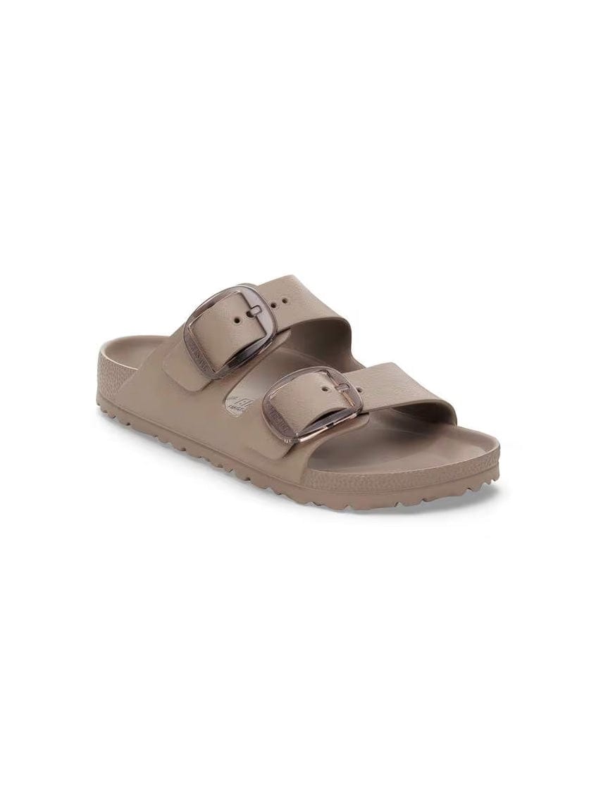 Brown sandal with two straps on a white background