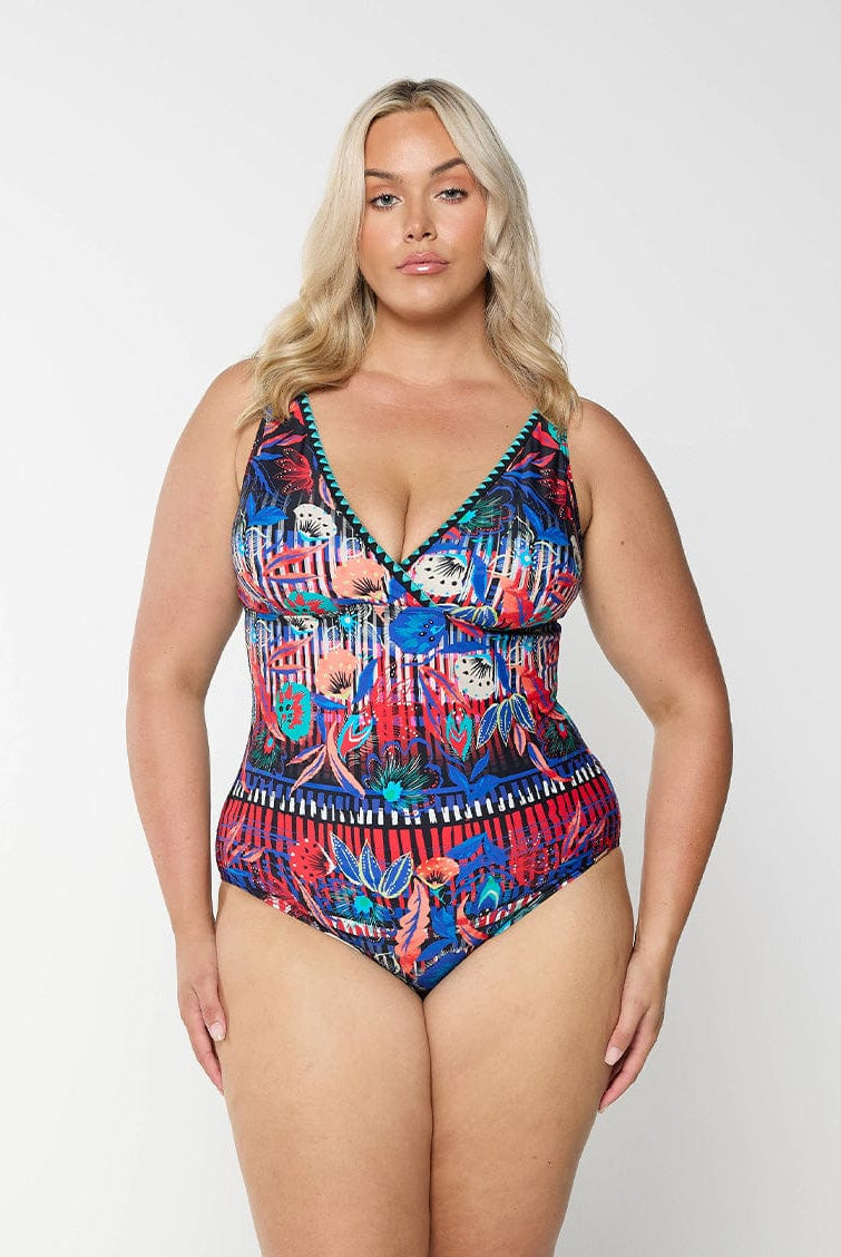 model wearing vibrant multi-coloured one piece swimsuit