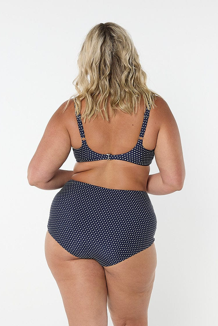 model showing back clip for navy dots underwire bikini top