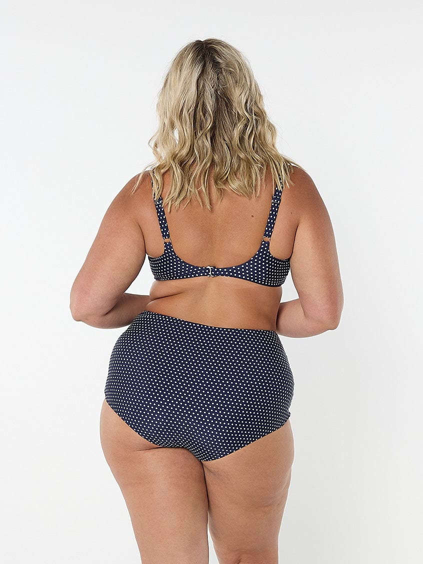model showing back clip for navy dots underwire bikini top