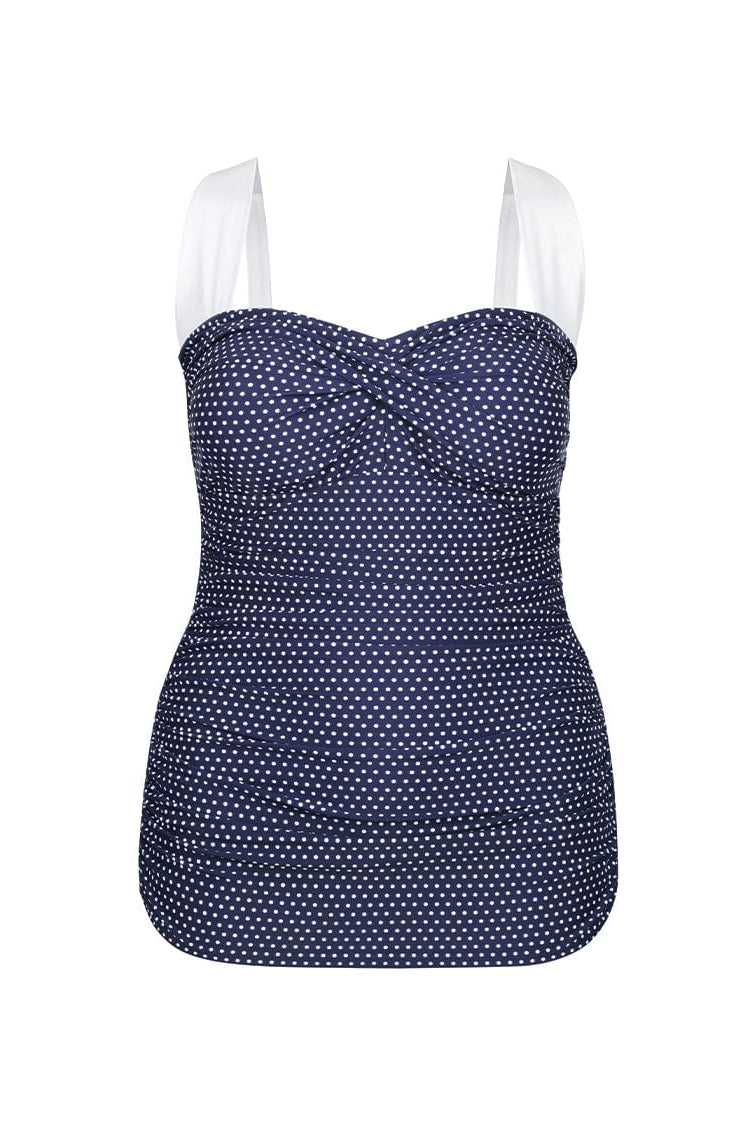 Navy blue and white polka dots swimsuit on a white background