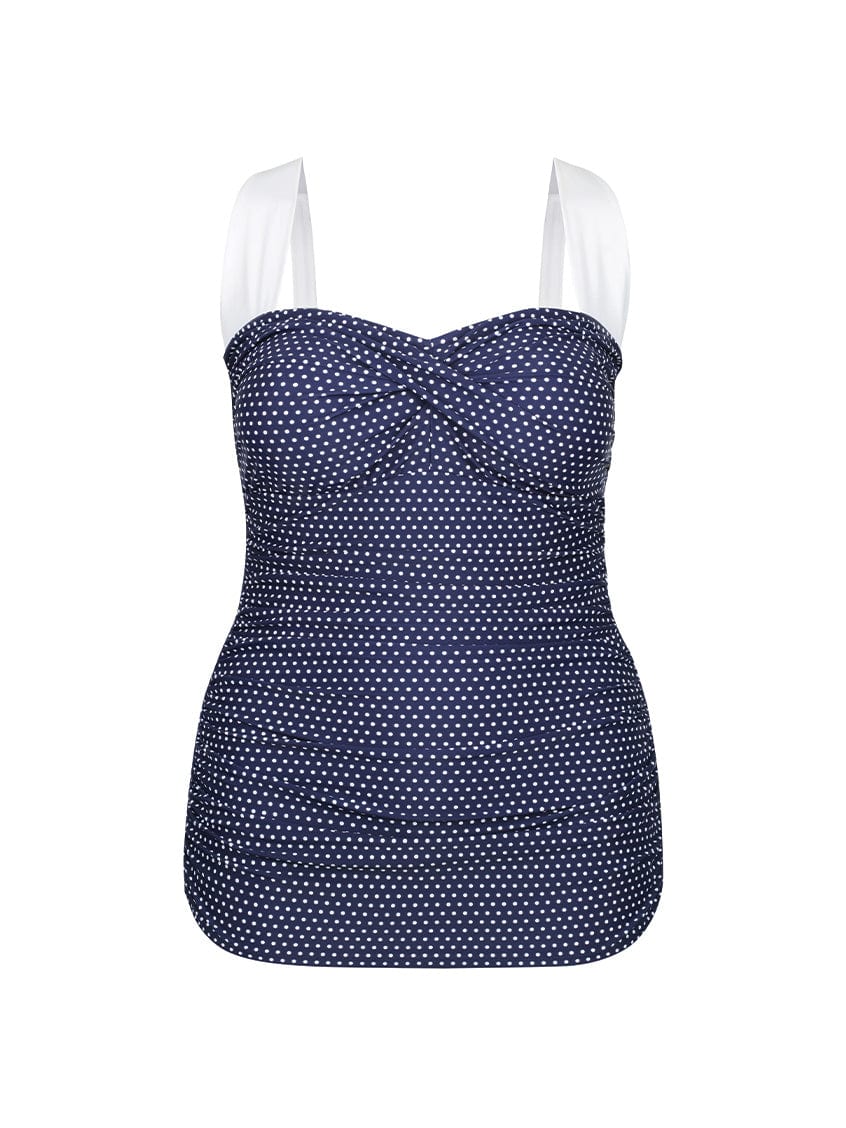 Navy blue and white polka dots swimsuit on a white background