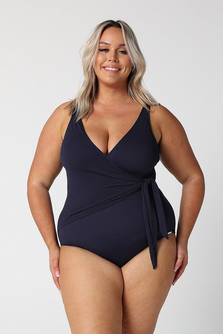 model wearing textured navy tie side one piece