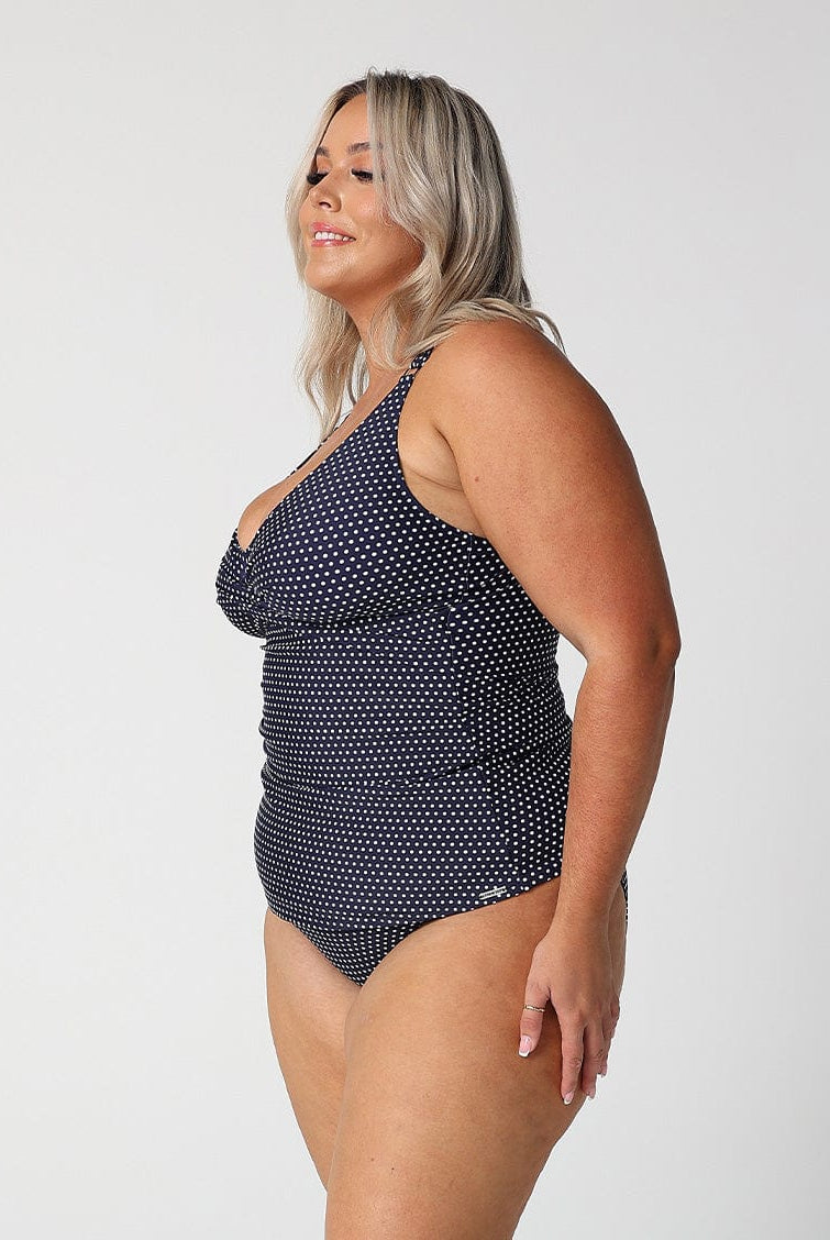 model showing side of navy dots swing tankini