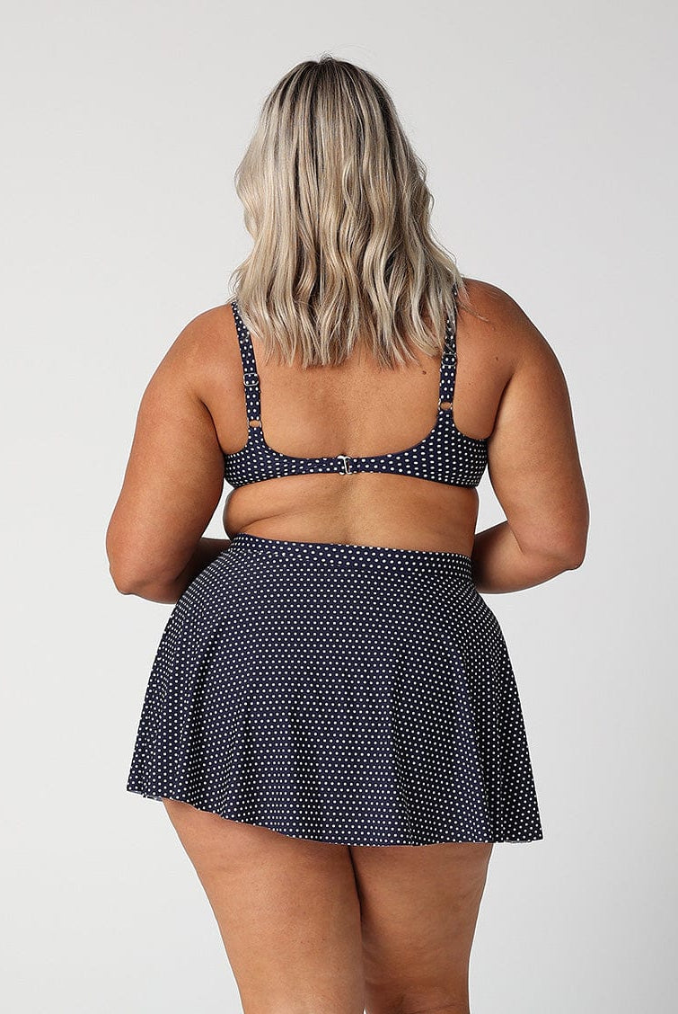 model showing back of navy dots skater skirt